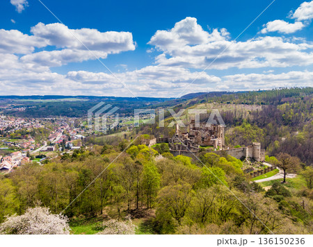Aerial drone panorama view of medieval castle Boskovice. Ruin of ancient stronghold placed at hill in South Moravia region, Czech Republic. Summer day with blue sky. 136150236