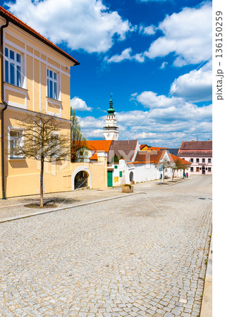 City town hall and clock tower at Boskovice city, South Moravia region, Czech republic. Summer day, blue sky. City town hall and clock tower at Boskovice city, South Moravia region, Czech republic. Summer day, blue sky. 136150259