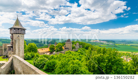 Panorama view of medieval castle Helfstyn, Czech Republic. Detail of tower with stone walls at ancient fortress. Sunny day, blue sky with clouds. 136150282