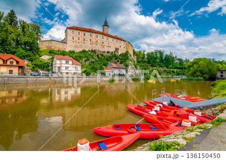 Panoramic view of castle above river in Ledec nad Sazavou. Sazava river is famous target for kayaking. Summer weather with dramatic clouds. Czech Republic. 136150450