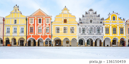 Main square of Telc with its famous 16th-century colorful houses, a UNESCO World Heritage Site since 1992, on a winter day with falling snow. Main square of Telc with its famous 16th-century colorful houses, a UNESCO World Heritage Site since 1992, on a winter day with falling snow. 136150459