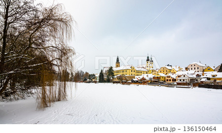View of Telc castle in winter, during snowfalling. Historical building is part of UNESCO heritage. Czech Republic. View of Telc castle in winter, during snowfalling. Historical building is part of UNESCO heritage. Czech Republic. 136150464
