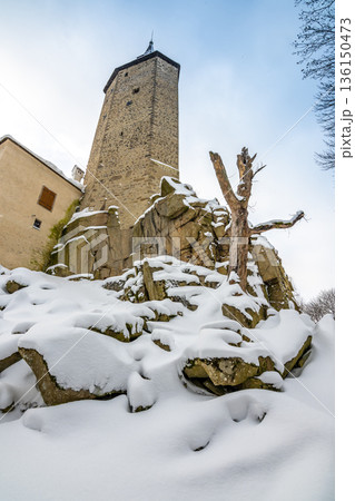 Medieval castle Rostejn in winter during snowfalling. Castle is placed in deep forest near Telc city. Winter and snow, beautiful nature. Medieval castle Rostejn in winter during snowfalling. Castle is placed in deep forest near Telc city. Winter and snow, beautiful nature. 136150473