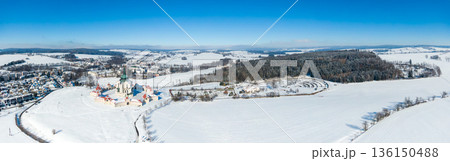 Aerial drone view of Pilgrimage Church of Saint John of Nepomuk, Zdar nad Sazavou, Czech Republic. UNESCO heritage. Ancient monastery at Zelena Hora hill. Winter weather with snow, blue sky. Aerial drone view of Pilgrimage Church of Saint John of Nepomuk, Zdar nad Sazavou, Czech Republic. UNESCO heritage. Ancient monastery at Zelena Hora hill. Winter weather with snow, blue sky. 136150488