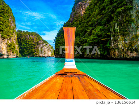 View of Pi Leh lagoon (also known as Green Lagoon) at Ko Phi Phi islands, Thailand. View from typical long tailed boat. Typical Thai picture of tropical paradise. Limestone rock and turquoise water. 136150614