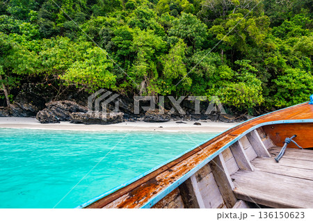 View of monkey beach at Ko Phi Phi islands, Thailand. Famous tropical beach with white sand and turquoise water. View from long tail boat. Summer paradise. 136150623