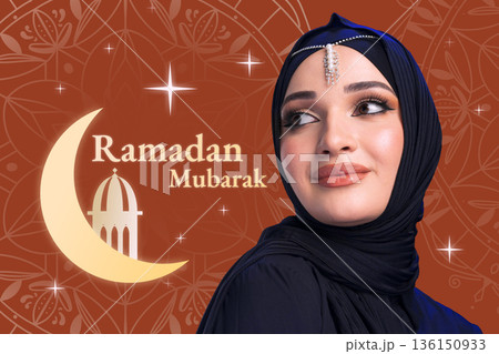 Celebration of Ramadan with a woman wearing hijab and a greeting of Ramadan Mubarak 136150933