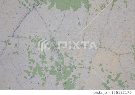 light green concrete wall texture.Texture of cracks on the wall. Old shabby wall. Texture peeling paint. 136152179