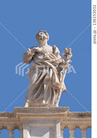 St. Joseph, fragment of colonnade of St. Peters Basilica in Rome, Italy 136153032