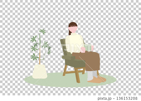 植物のある部屋の一人がけソファで本を読む女性 136153208
