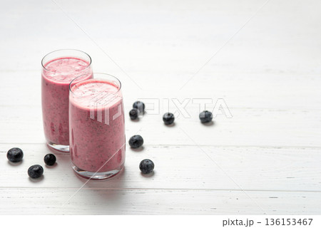 Two glasses of berry smoothie with chia and fresh berries 136153467