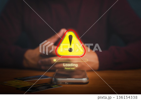 Warning alert symbol with loading bar on smartphone screen, showing error or system failure concept related to online payment, security issue, or digital transaction problem with credit card. 136154338