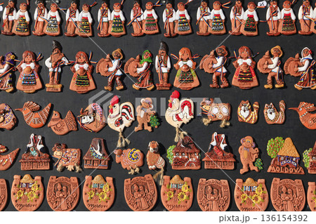 Moldavian handmade souvenir magnets in a souvenir shop. 136154392