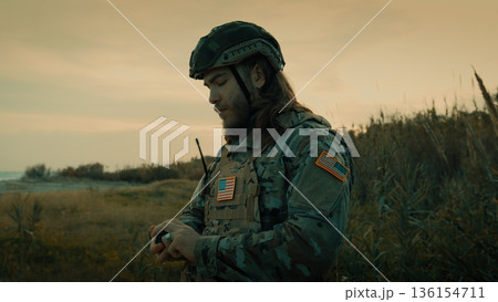 American soldier ready for war attack on a beach American soldier ready for war attack on a beach 136154711