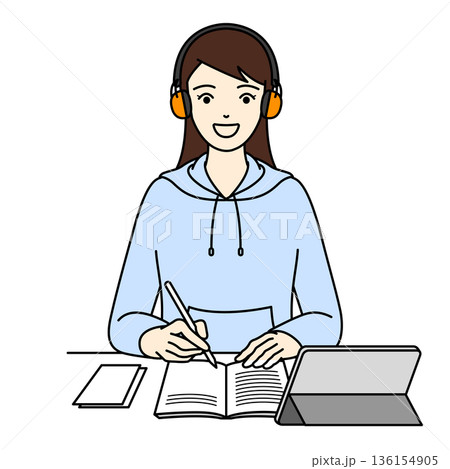聴覚過敏対策のイヤーマフを着用して笑顔で学習する女性 136154905