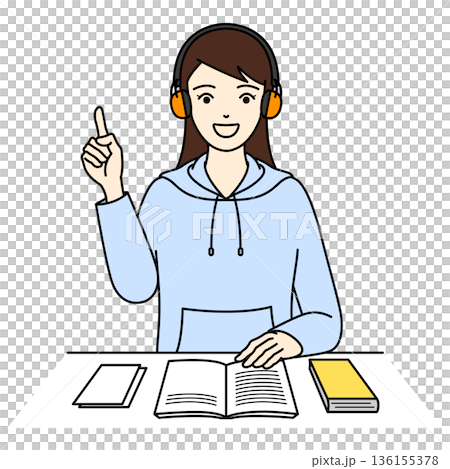 A woman studying with a smile and pointing at something while wearing earmuffs for hearing loss 136155378