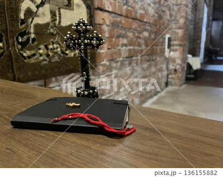 new testament with other church objects on the bench in church 136155882