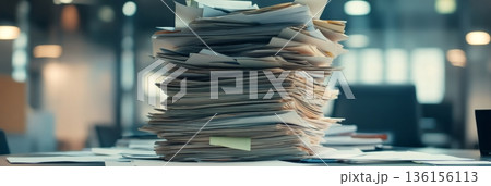 Towering stack of papers dominates a cluttered office desk, symbolizing the chaos and stress of multitasking and time management in a busy work environment Towering stack of papers dominates a cluttered office desk, symbolizing the chaos and stress of multitasking and time management in a busy work environment 136156113