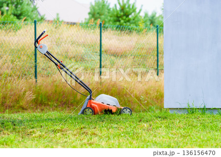 Gardening. Mowing lawn with lawnmower Gardening. Mowing lawn with lawnmower 136156470