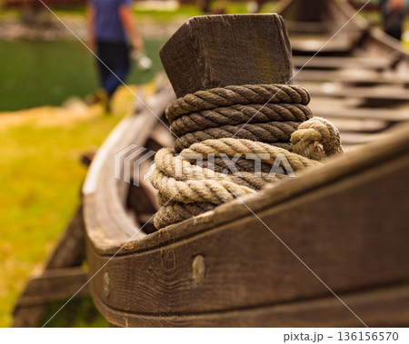 Old viking boat on fjord shore, Norway 136156570