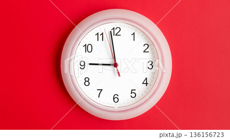 clock on wall showing nine hours 136156723