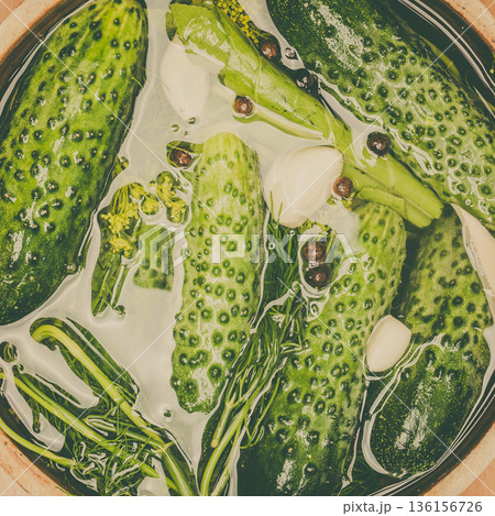 Making pickled cucumbers in clay jar Making pickled cucumbers in clay jar 136156726