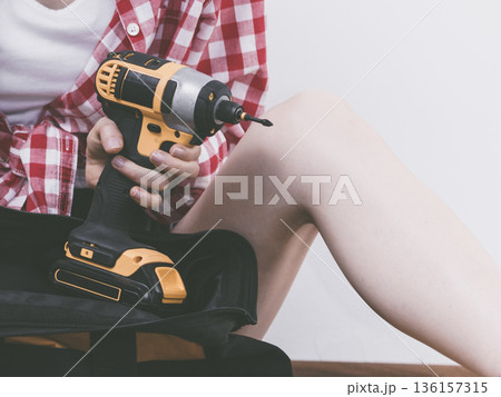 Woman constructive worker with tool bag Woman constructive worker with tool bag 136157315