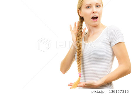 Blonde young woman with braid hair Blonde young woman with braid hair 136157316