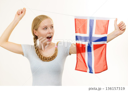 Young woman with norwegian flag 136157319