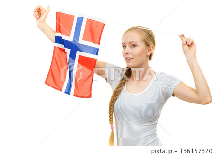 Young woman with norwegian flag 136157320