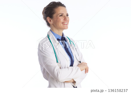Optimistic Doctor Looking Up and Smiling Optimistic Doctor Looking Up and Smiling 136158237