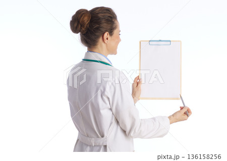 Doctor Explaining Medical Results on Clipboard 136158256