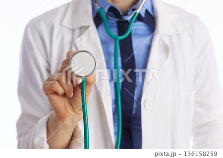 Close Up of Doctor Holding Stethoscope Diaphragm Close Up of Doctor Holding Stethoscope Diaphragm 136158259
