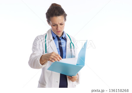 Female Physician Reviewing Medical Records 136158268