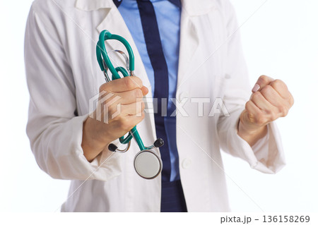 Determined Medical Professional with Clenched Fist 136158269