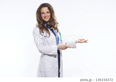 Doctor Explaining with Open Hand Gesture Doctor Explaining with Open Hand Gesture 136158372