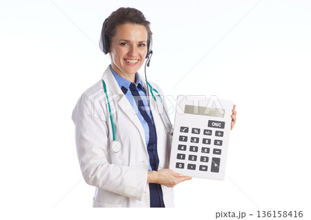 Medical Professional with Calculator for Billing and Insurance 136158416