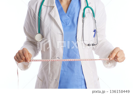 Healthcare Professional Holding Measuring Tape 136158449