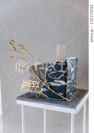 Luxury black marble birthday cake with gold details and Happy Birthday topper, copy space Luxury black marble birthday cake with gold details and Happy Birthday topper, copy space 136159583