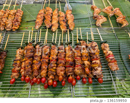 Asian street food grilled chicken skewers on banana leaves Asian street food grilled chicken skewers on banana leaves 136159950