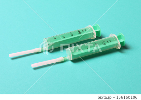 Top view of medical syringes on colorful background with copy space. Injection equipment concept 136160106