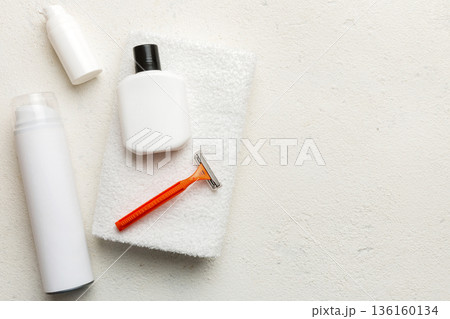 shaving man set. shaving machine, towel, lotion and shaving foam on colored background. Men bath Accessories top view shaving man set. shaving machine, towel, lotion and shaving foam on colored background. Men bath Accessories top view 136160134