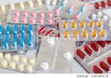 too many different pill of various blisters with different pills Medicines storage at home concept Medication storing. A pile of medicine in blister packs. Pharmaceutical blister packs 136160178