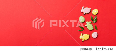 holiday preparation Multi colors Easter eggs with cookies on colored background . Pastel color Easter eggs. holiday concept with copy space holiday preparation Multi colors Easter eggs with cookies on colored background . Pastel color Easter eggs. holiday concept with copy space 136160348