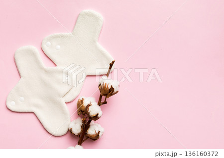 set of colorful bright reusable menstrual pads with cotton flower. zero waste woman periods concept top view with copy space 136160372