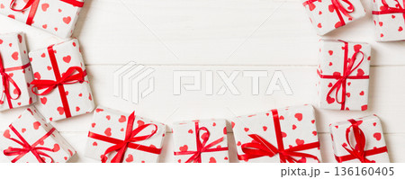 Frame of many Colorful gift boxes with red bow and heart blank copy space top view, Valentine or other holidays celebrations concept Frame of many Colorful gift boxes with red bow and heart blank copy space top view, Valentine or other holidays celebrations concept 136160405