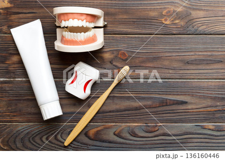 Mouthwash and other oral hygiene products on colored table top view with copy space. Flat lay. Dental hygiene. Oral care kit. Dentist concept Mouthwash and other oral hygiene products on colored table top view with copy space. Flat lay. Dental hygiene. Oral care kit. Dentist concept 136160446