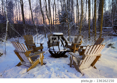 Chairs by fire during twilight foster intimate winter moments 136162150