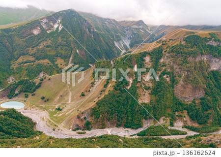 Mountain landscape with river and lake under cloudy sky in Georgia Mountain landscape with river and lake under cloudy sky in Georgia 136162624