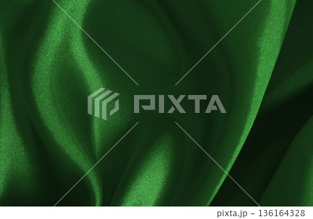 Dark green fabric cloth texture for background and design art work, beautiful crumpled pattern of silk or linen. 136164328